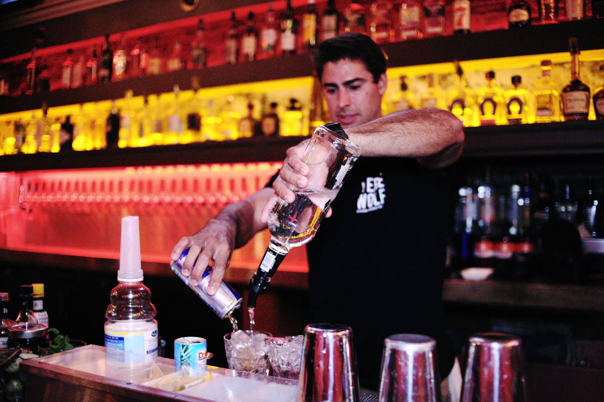 Bartender pouring drinks at Werewolf American Pub during Crappy Hour in the Gaslamp